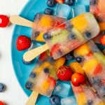 Homemade popsicles with berries and fruits.